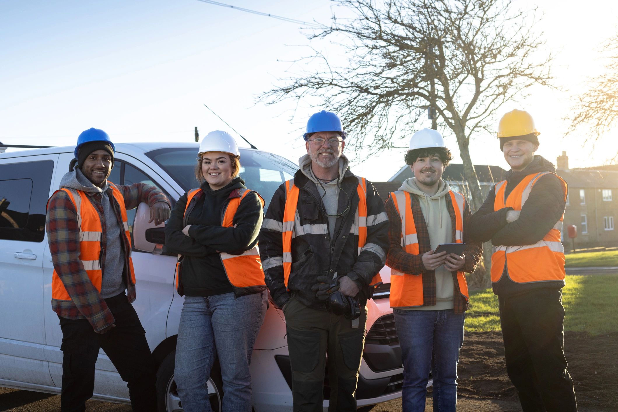Support team standing together at a worksite
