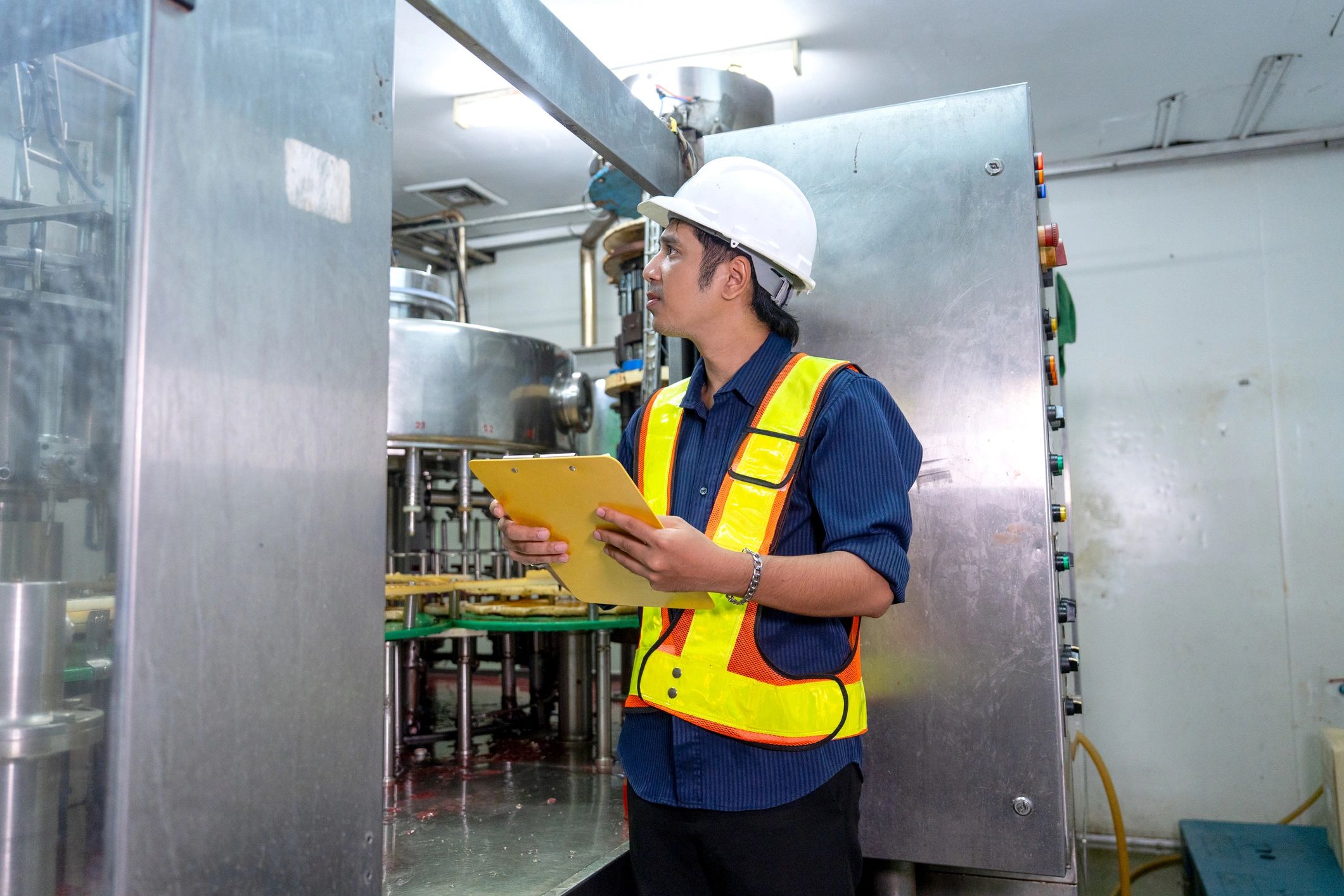 Technician reviewing HVAC installation work